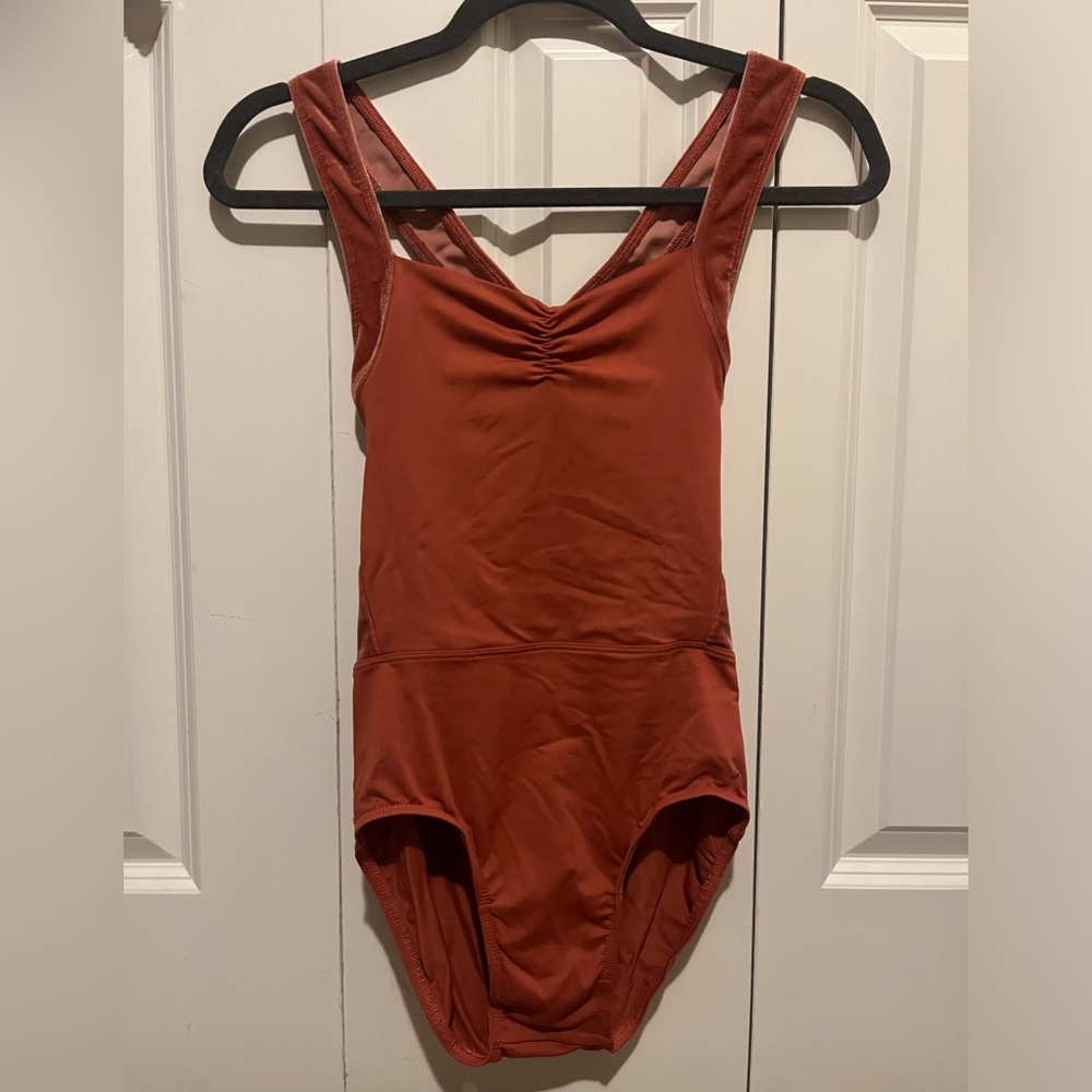 Suffolk leotard. Size Medium adult. Orange color with crisscross back